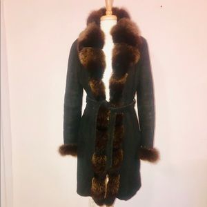 Elegant ladies coat with fur collar and cuffs.